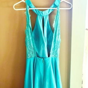 Bold beach blue fitted halter style backless dress